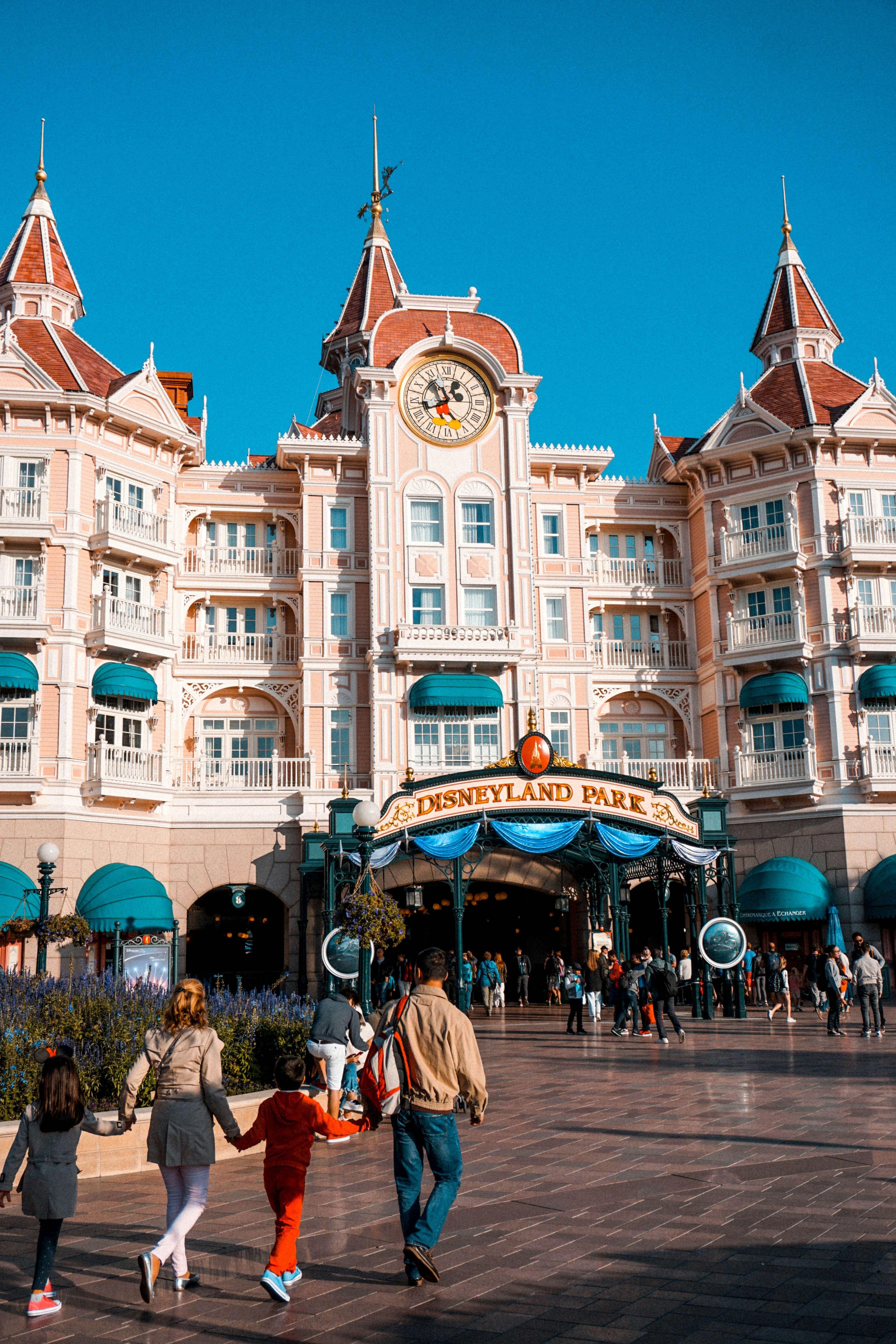 Family walking into Disneyland Paris park entrance