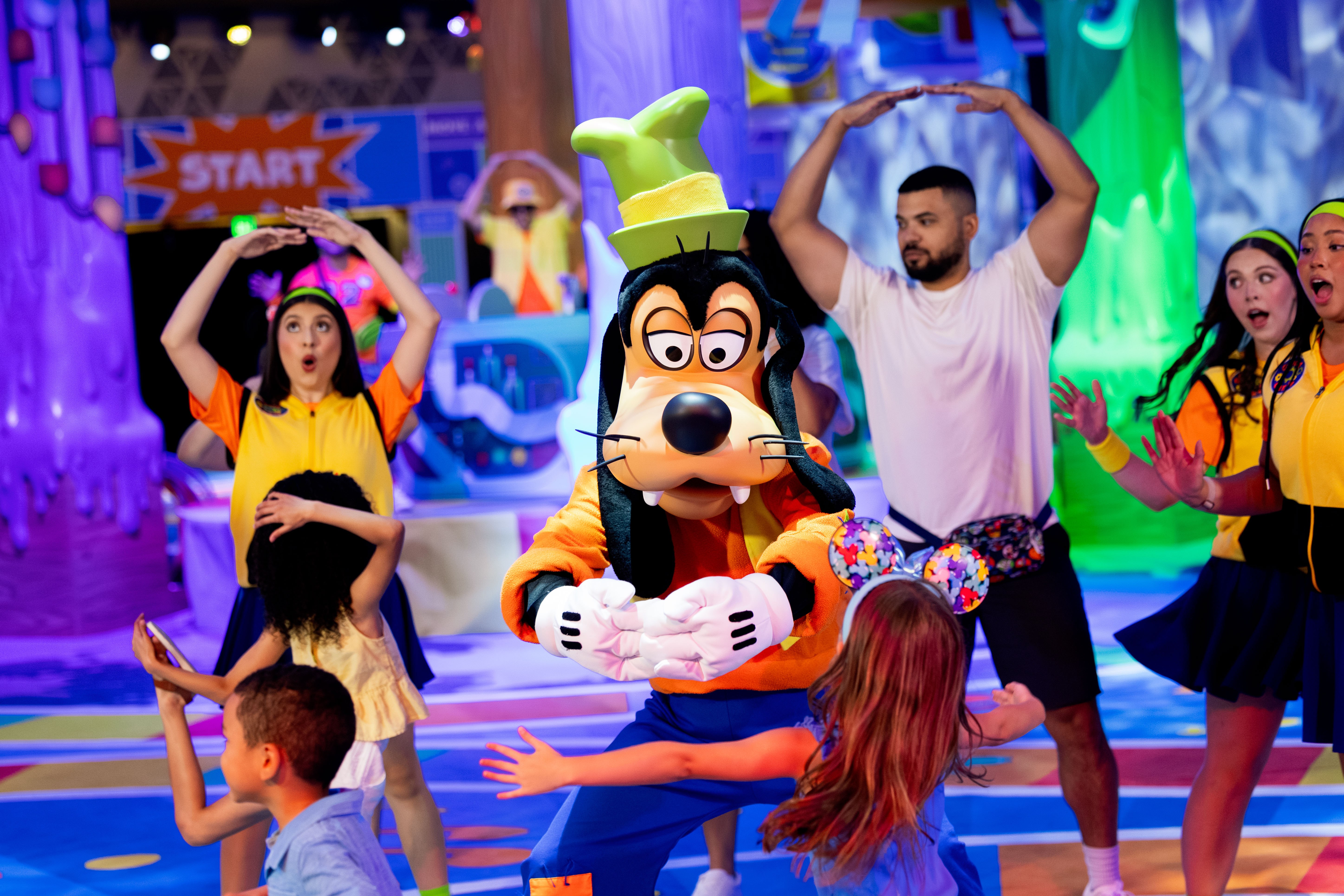 Goofy and families dancing at GoofyCore Walt Disney World