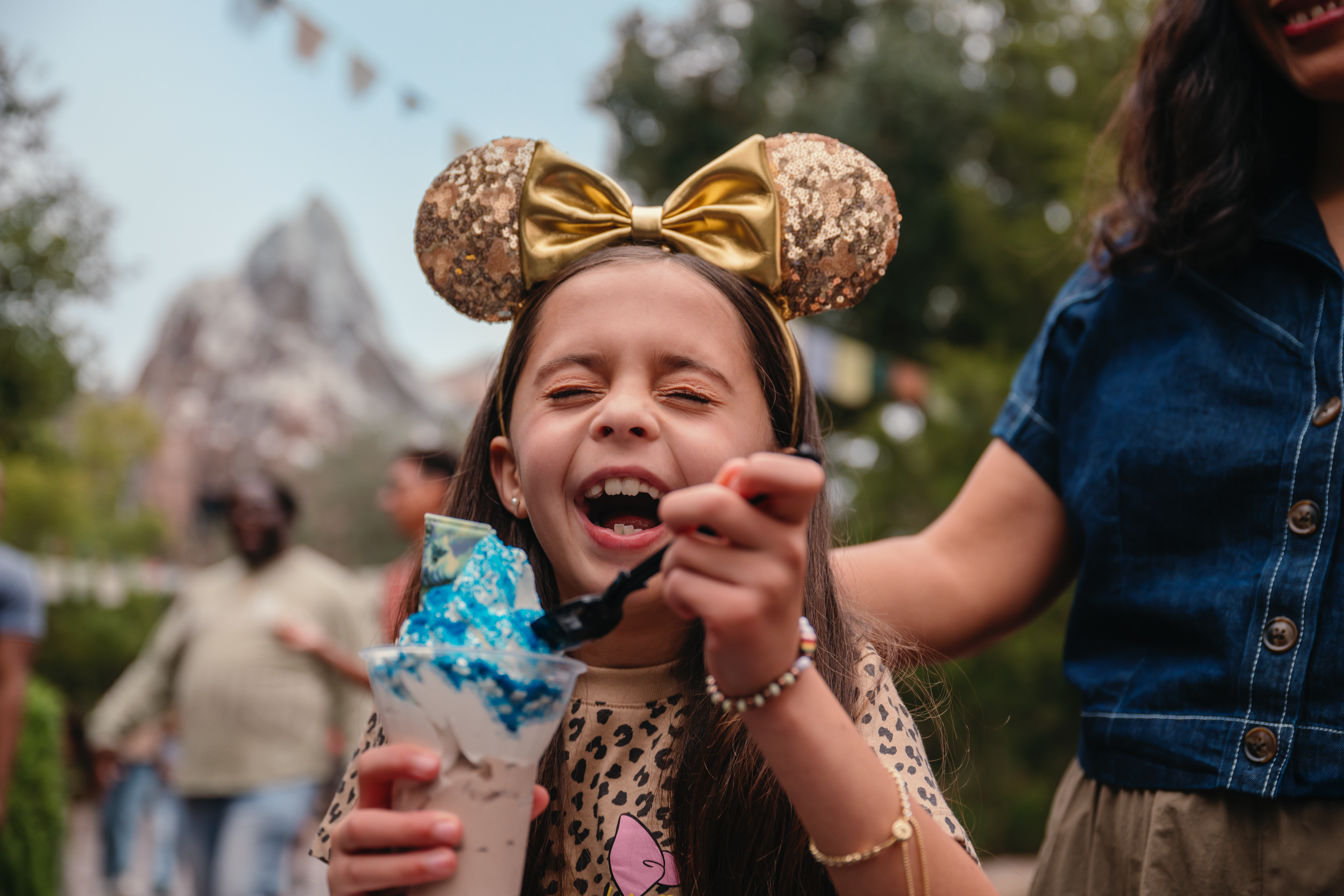 Girl with Mickey ears and Yeti sundae at Disney World